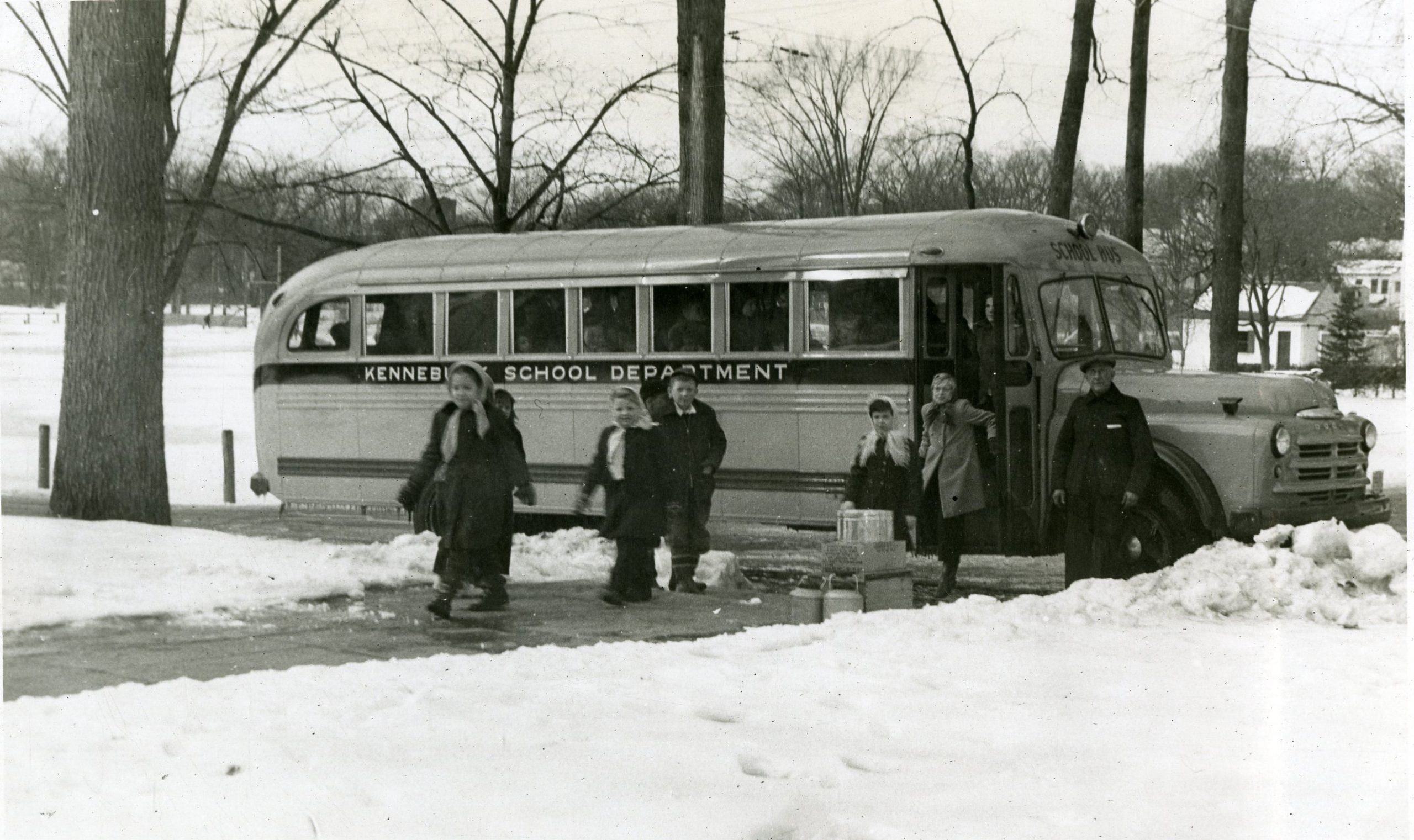 Children getting off a school bus, c.1950